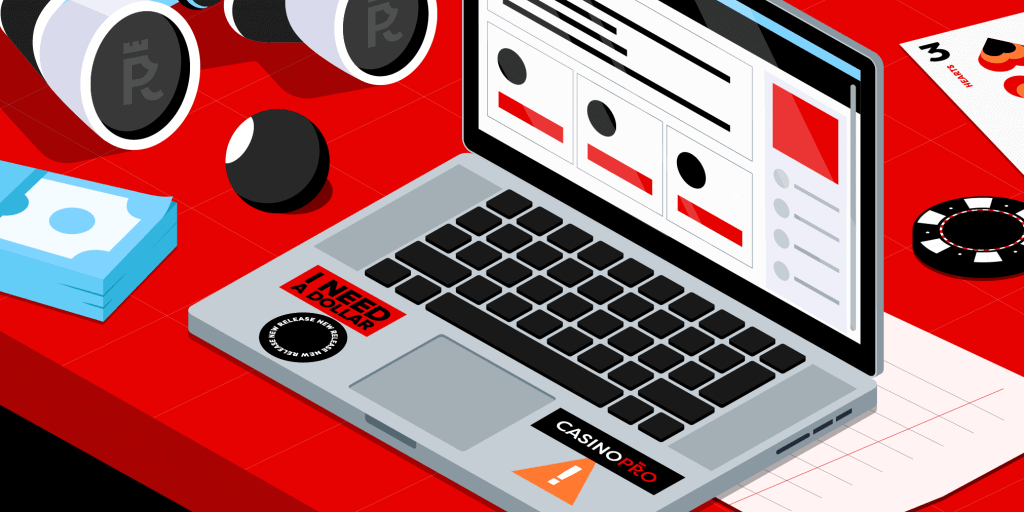 Laptop on a red table with stickers reading 'new release' and 'casinopro'